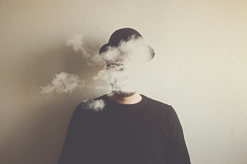 surreal man head in the clouds, abstract concept