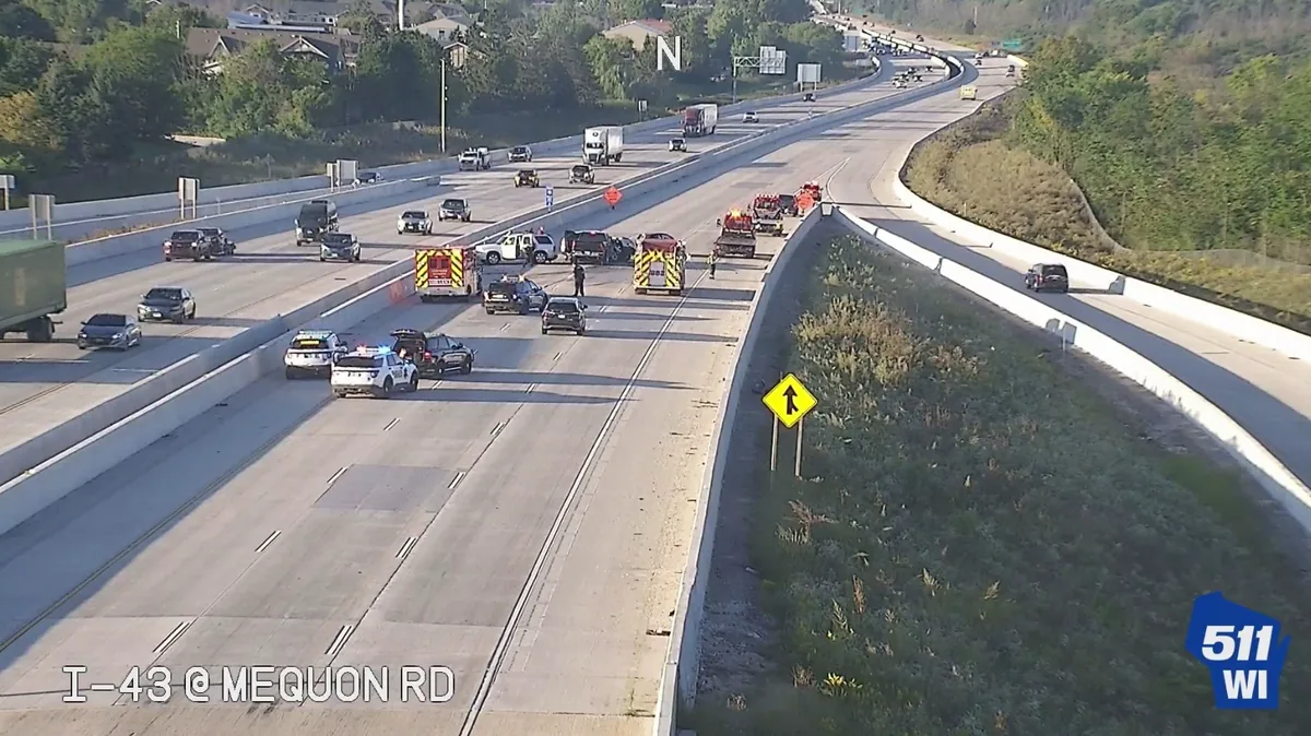 Police and emergency responders at a five-vehicle crash scene on I-43 North near Mequon Road