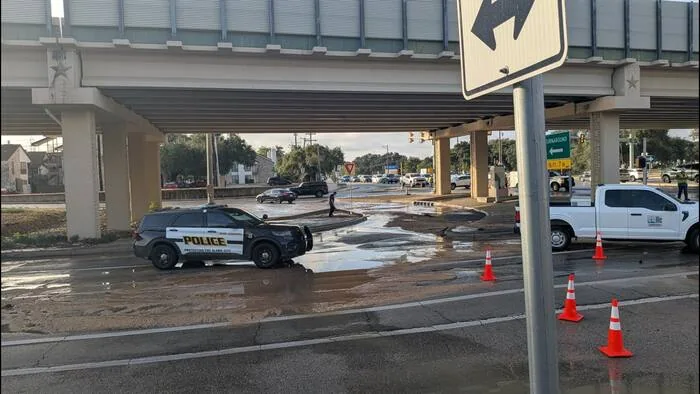 Floodwater covers part of a San Antonio roadway near Blanco Road and Wurzbach Parkway during a water main break